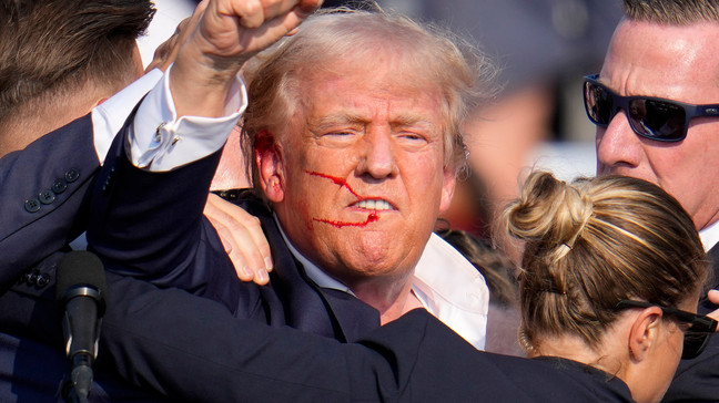 FILE - Republican presidential candidate former President Donald Trump reacts following an assassination attempt at a campaign event in Butler, Pa., on Saturday, July 13, 2024. Trump Media surged in the first day of trading, Monday, July 15, following the assassination attempt. (AP Photo/Gene J. Puskar, File)