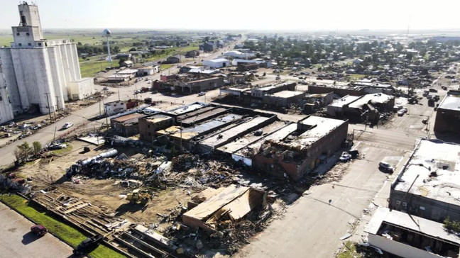 A lumber yard and hardware store along with other businesses are damaged on Friday, June 16, 2023, in Perryton, Texas, from a tornado that swept through the region the night before. (AP Photo/David Erickson)