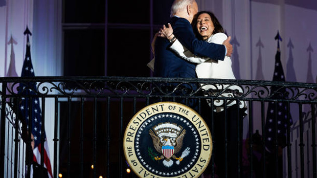 US President Joe Biden, left, and Vice President Kamala Harris on the Truman Balcony of the White House in Washington, DC, US, on Thursday, July 4, 2024. Biden's reelection campaign limped into the US Independence Day holiday, exhausted by a week of the incumbent clawing to maintain his hold on his party's nomination. Photographer: Tierney L. Cross/Bloomberg via Getty Images