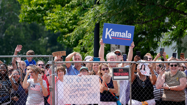 Supports hold signs before Vice President Kamala Harris arrives to deliver remarks at a campaign event in Pittsfield, Mass., Saturday, July 27, 2024. (AP Photo/Stephanie Scarbrough)